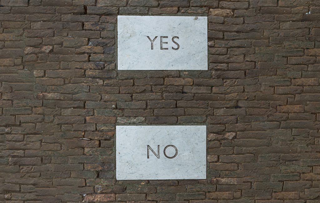 yes and no slabs on brick wall