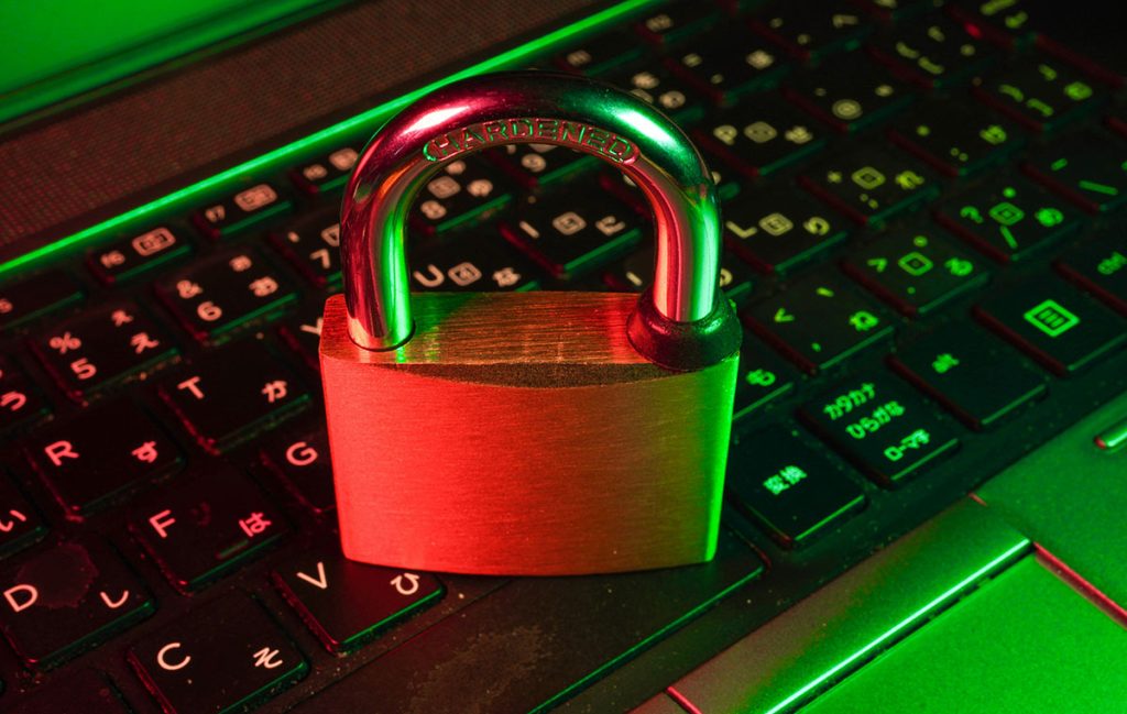 padlock placed on laptop keyboard